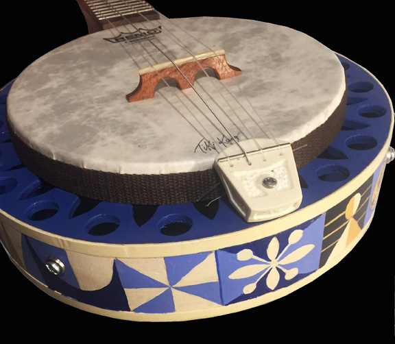 Tiki King small world inspired Banjo Uke healpiece detail